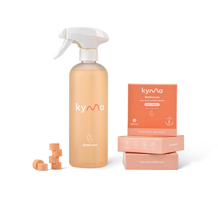 Kyma Bathroom Cleaner Bundle with refill tablets, spray bottle, and packaging in orange color.
